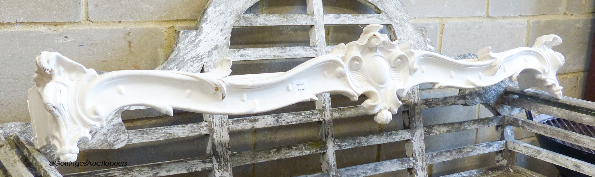 A 19th century white painted carved wood pelmet, length 154cm